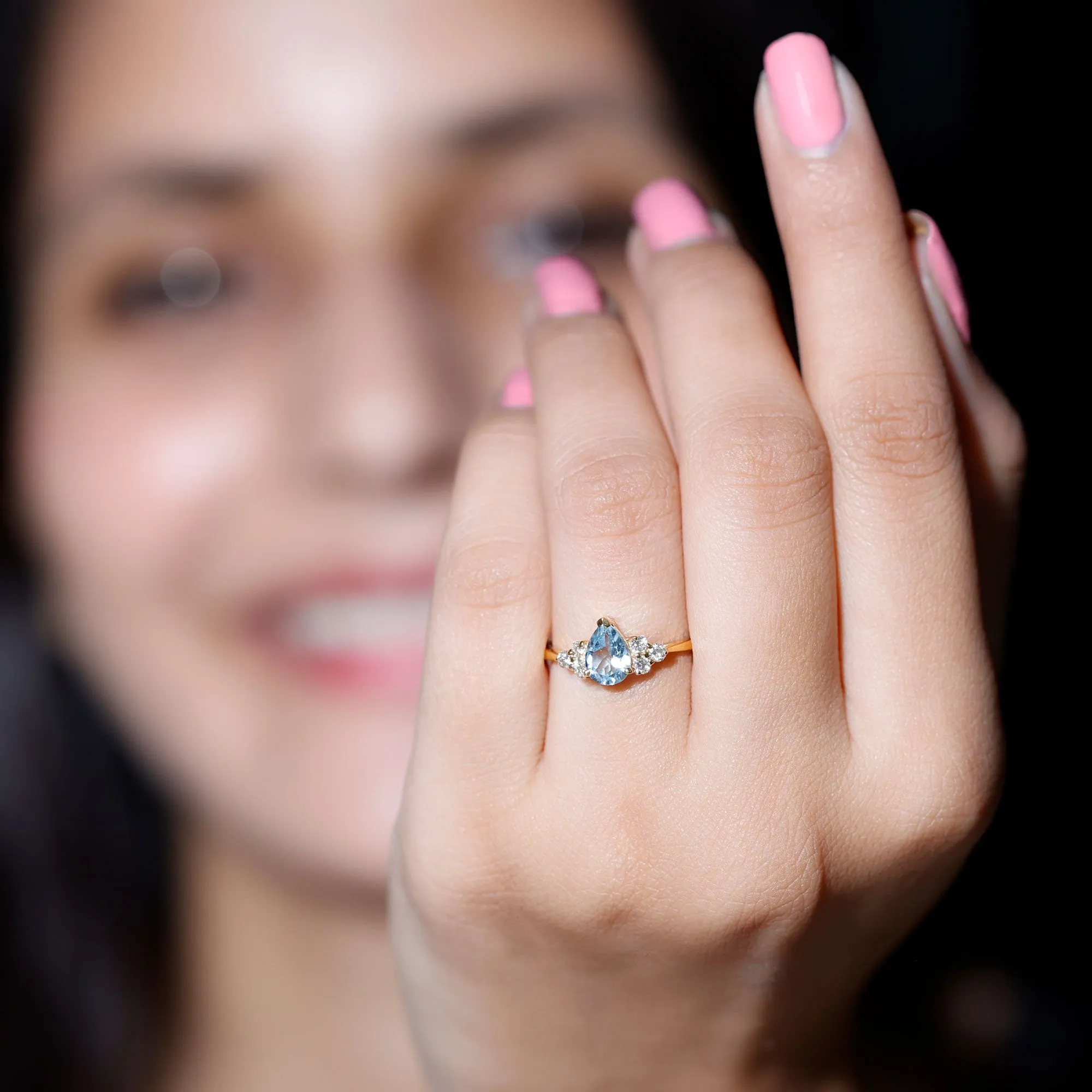 Claw Set Pear Cut Sky Blue Topaz Solitaire Ring with Diamond Trio